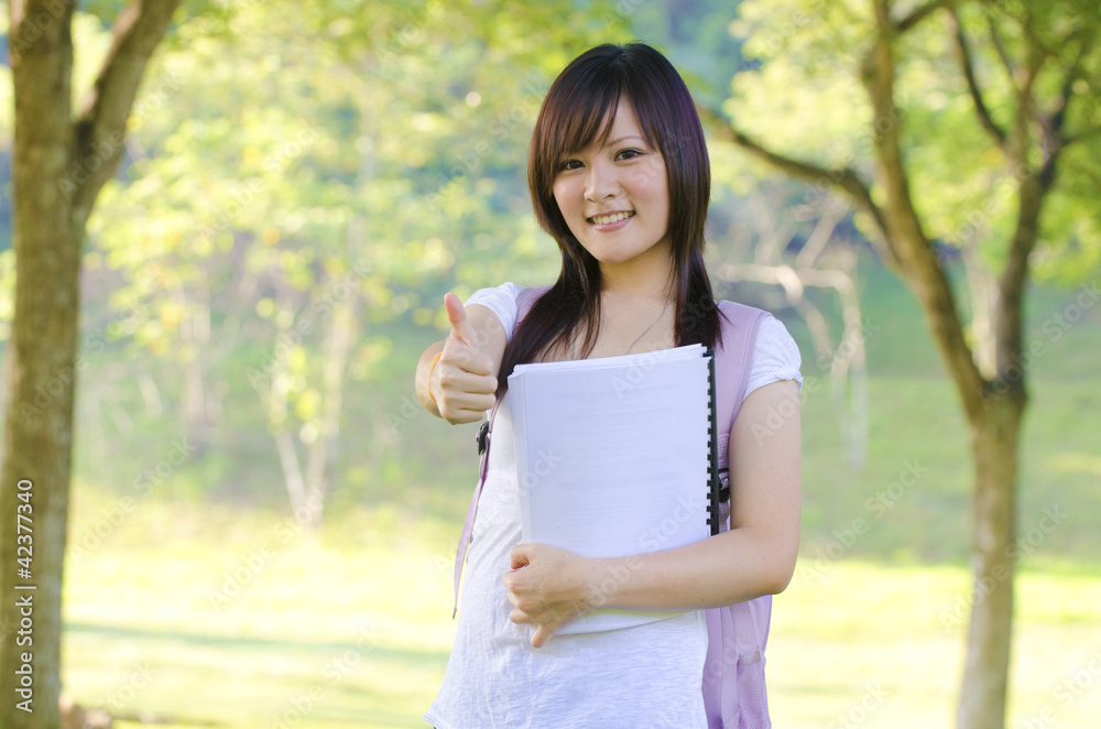 College student standing outside campus, green park College student standing outside campus, green park