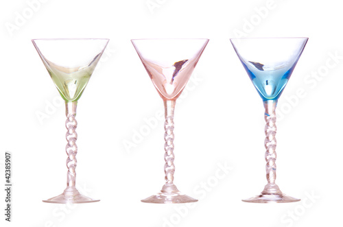 Line of colorful antique martini classes isolated on white