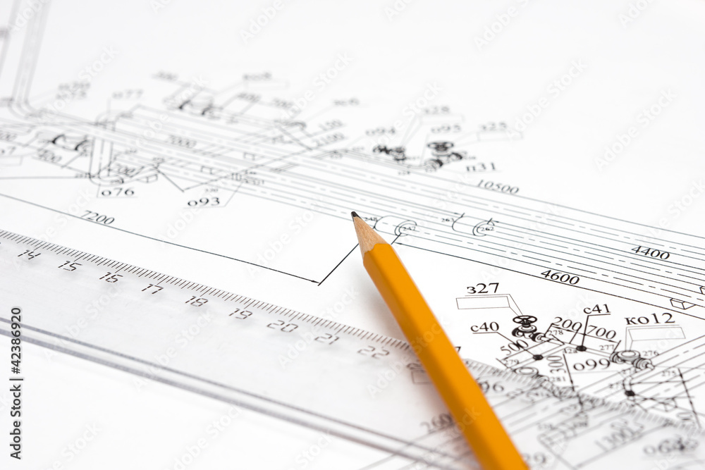 pencil and ruler against the unpacked drawing