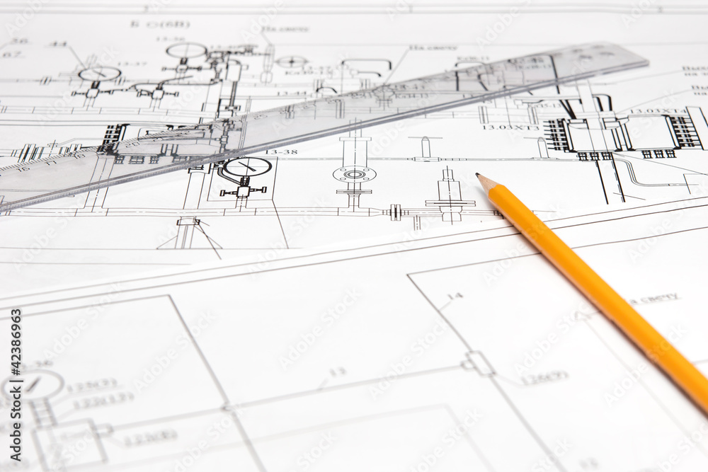 pencil and ruler against the unpacked drawing pencil and ruler against the unpacked drawing
