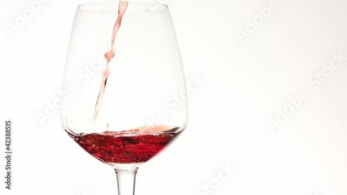 Red wine pouring in slow motion