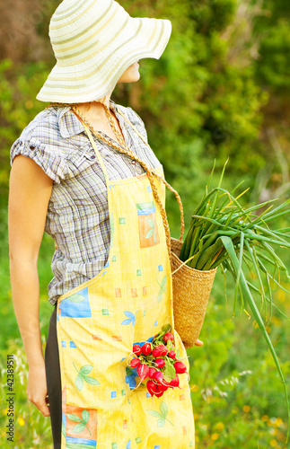 Happy woman gardener working