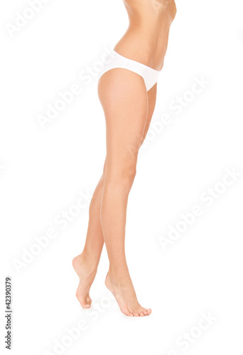 female legs in white bikini panties