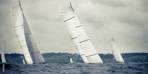 yacht sailing  in storm photo