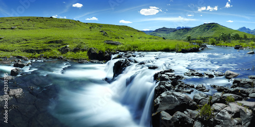 blue sky with rocky river