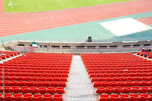 plastic seats in very big, empty stadium