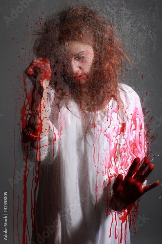 Horror Themed Image With Bleeding Freightened Woman photo