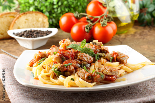 Pasta with chunks of fresh tuna, tomato and mint