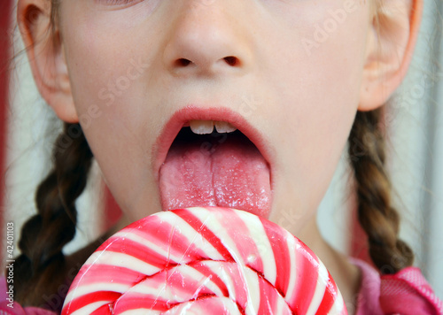 girl with a big candy lollipop