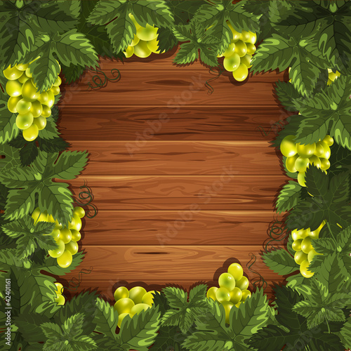 Grapes on wooden background