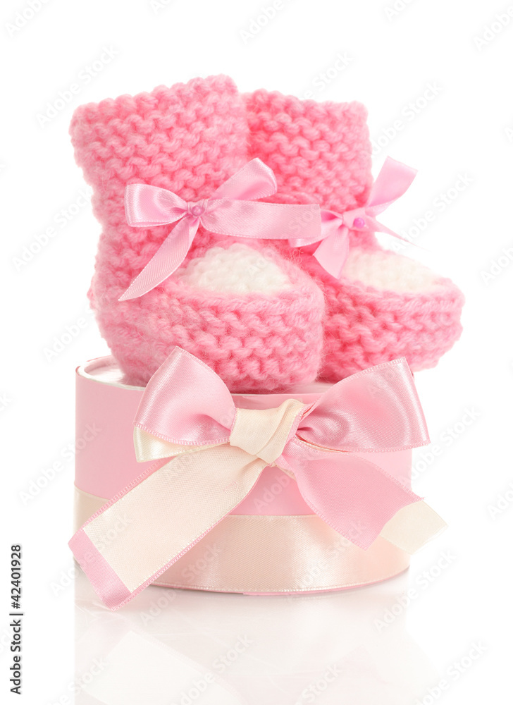 pink baby boots and gift isolated on white pink baby boots and gift isolated on white