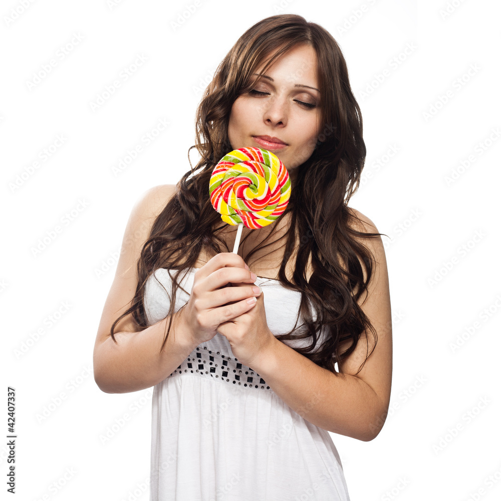Pretty young woman with lollipop candy