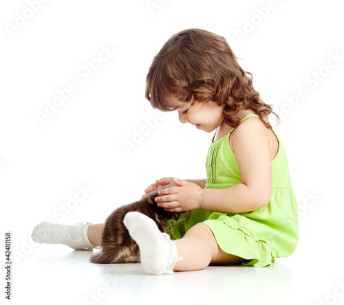 Little kid girl strokes kit...