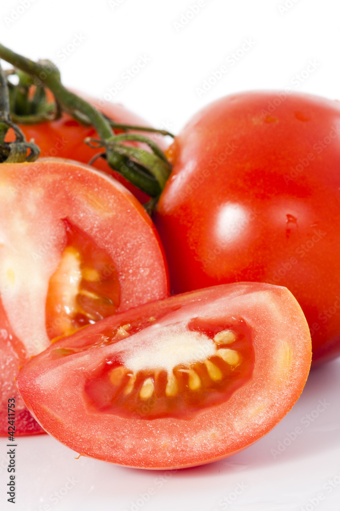 Red fresh tomato with cut on white background Red fresh tomato with cut on white background