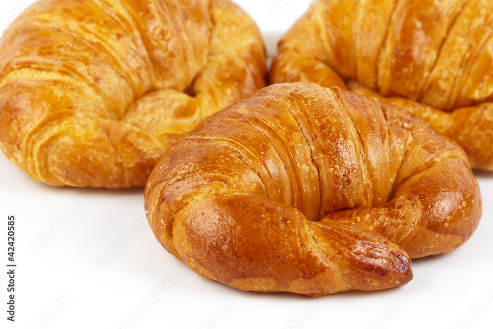Fresh and tasty croissant isolated on white background