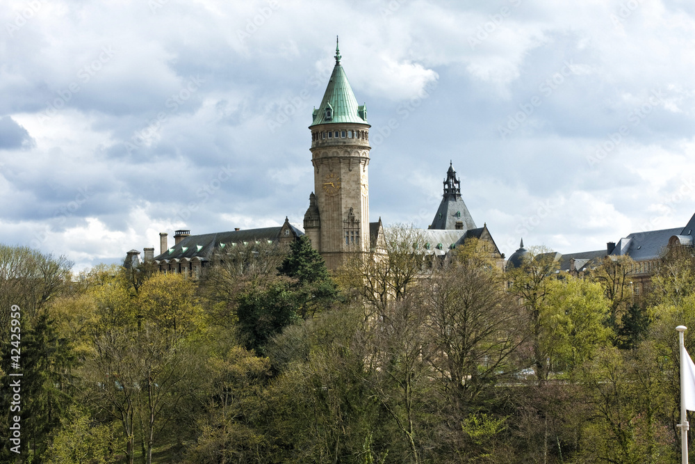 Luxembourg sight - castle tower with clock and blue sky Luxembourg sight - castle tower with clock and blue sky