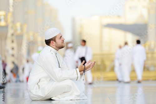 Muslim prayer at holy mosque