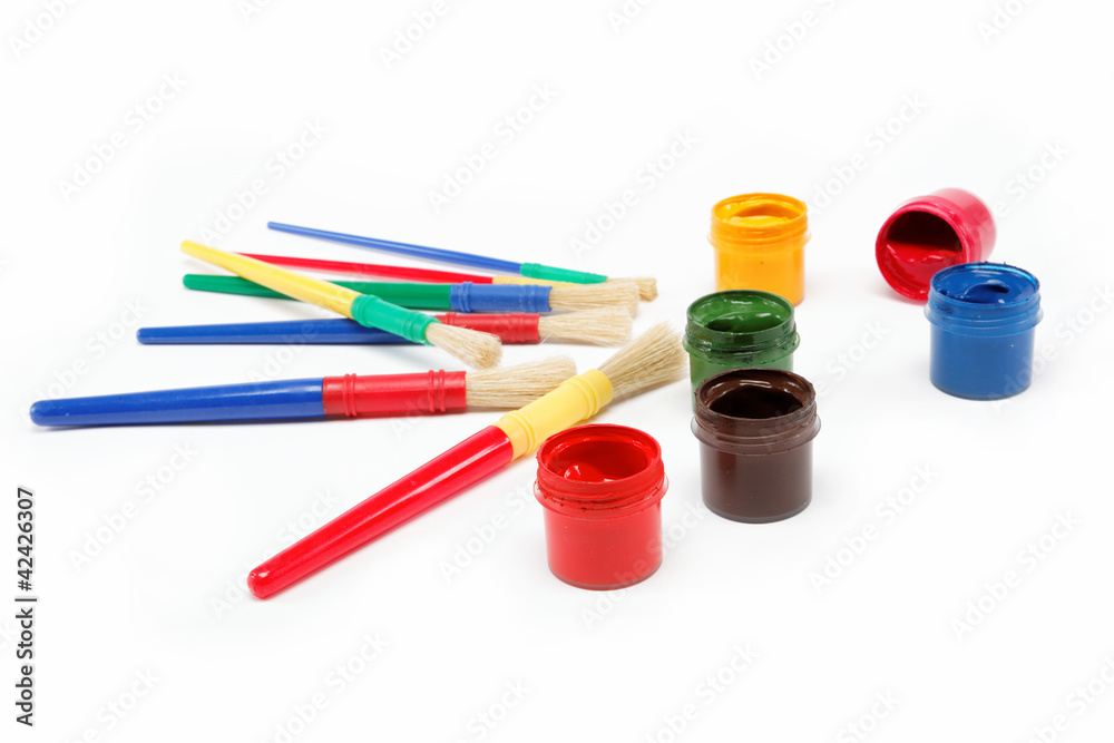 Brushes and paints isolated on a white background. Brushes and paints isolated on a white background.