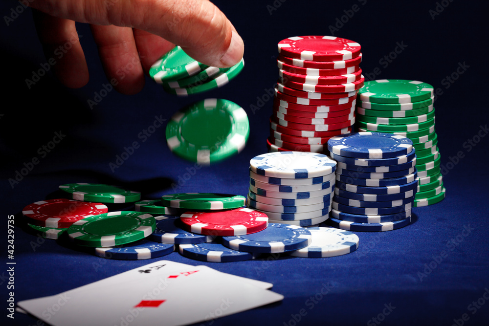 Stack of chips and two aces Stack of chips and two aces