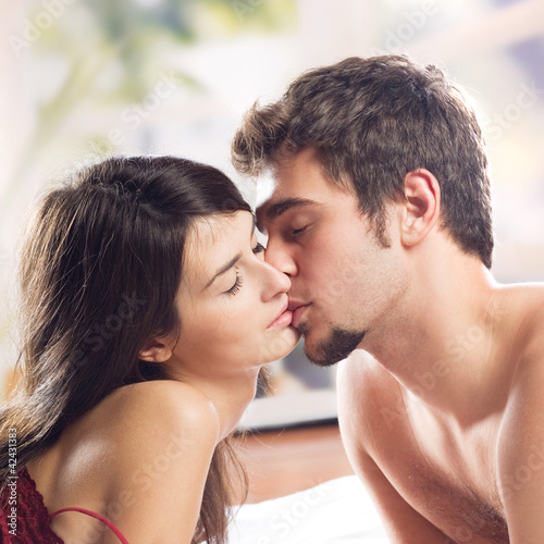 Couple making love in bed © vgstudio