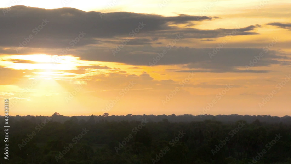 Sunset over a forest - Time lapse