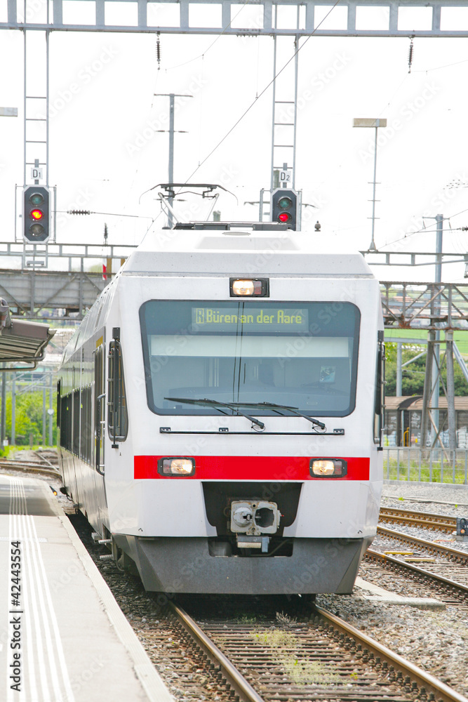 Fototapeta premium Train locomotive coming to Lausanne platform Station Switzerland