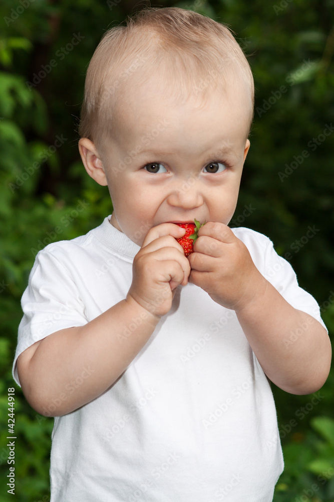 Beautiful child in summer garden Beautiful child in summer garden