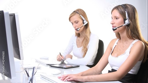 office workers,smiling secretaries ,computer,headphones,tablet