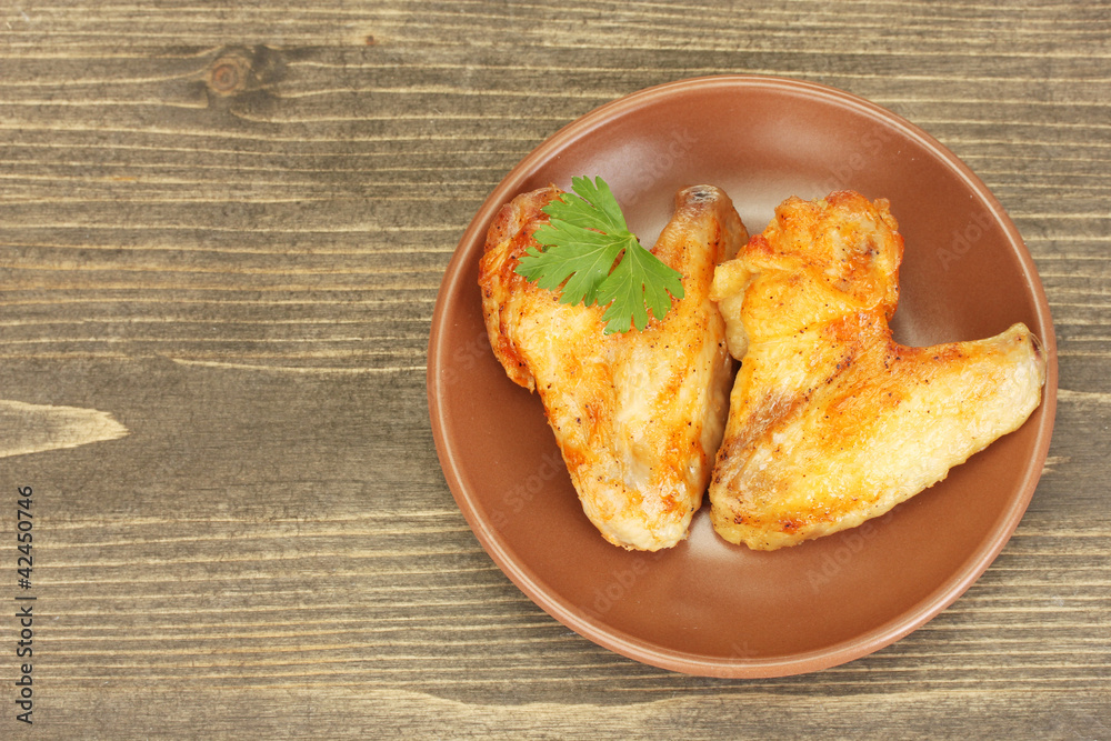 roasted chicken wings with parsley in the plate roasted chicken wings with parsley in the plate