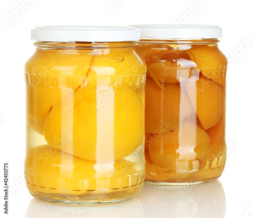 Jars of canned fruits isolated on white
