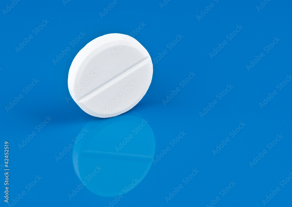 Pill on blue background Pill on blue background