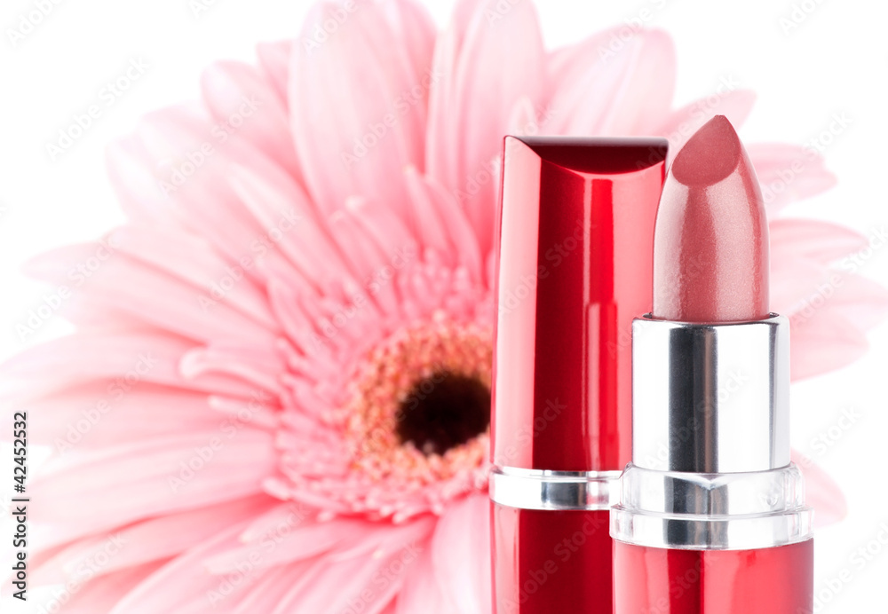 Lipstick with flower on background Lipstick with flower on background