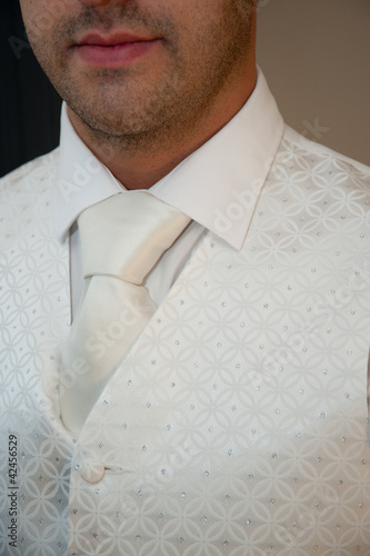Groom wearing waistcoat and tie