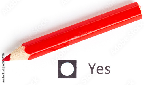 Red pencil choosing between yes or no