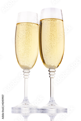 Two glasses of champagne isolated on white