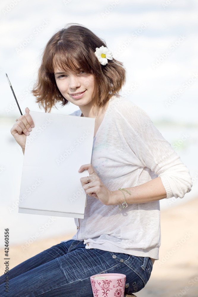 The girl shows a blank leaf The girl shows a blank leaf