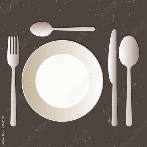 Place setting with plate, knife, spoons and fork