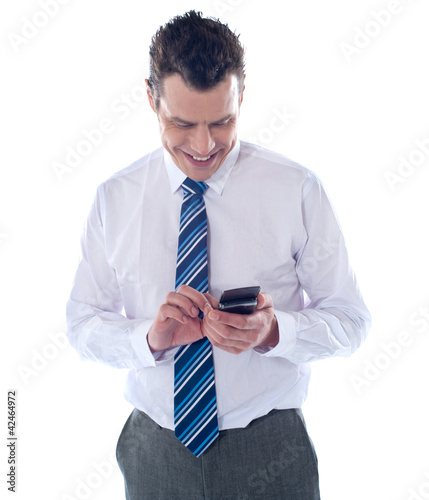 Business executive reading text message