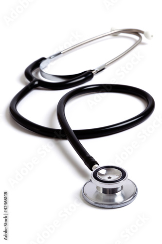 Black medical stethoscope isolated on white