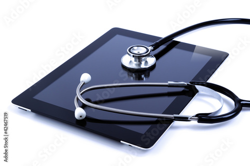 Digital tablet with stethoscope isolated on white