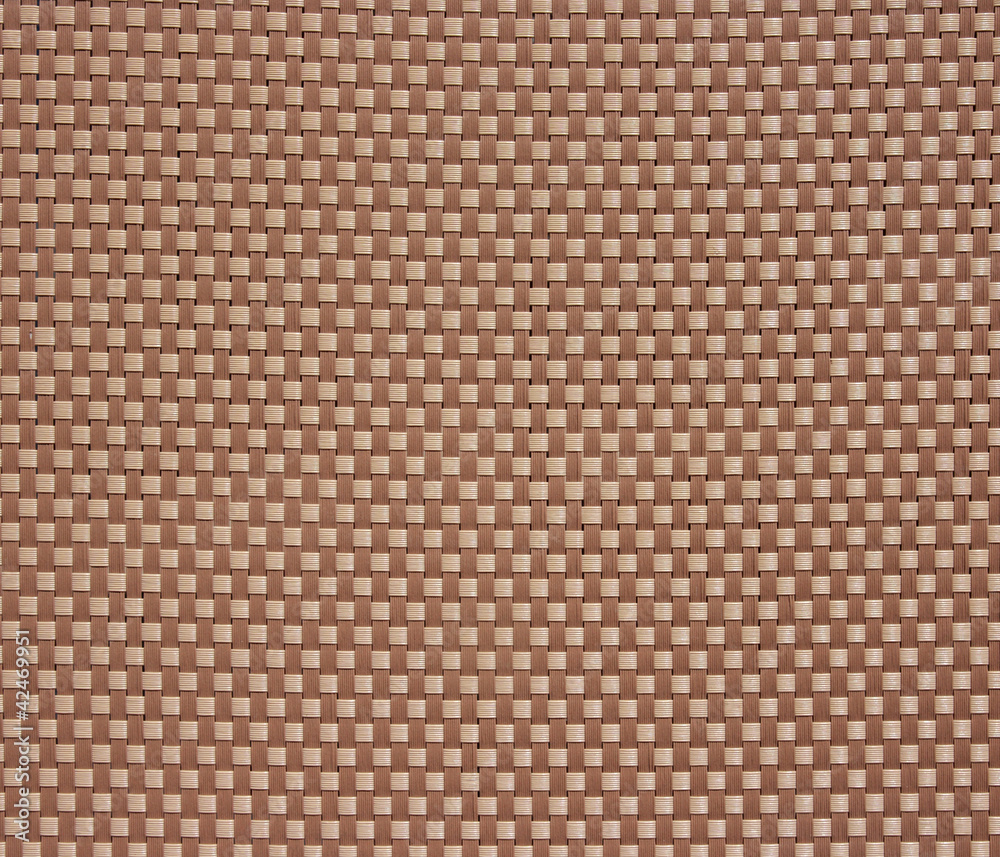 Braided from plastic strips may be used as background.