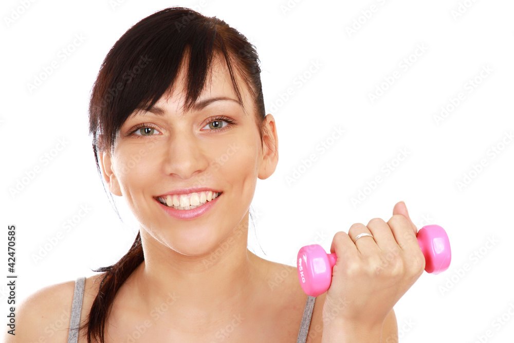 Young fitness woman exercising isolated on white background Young fitness woman exercising isolated on white background