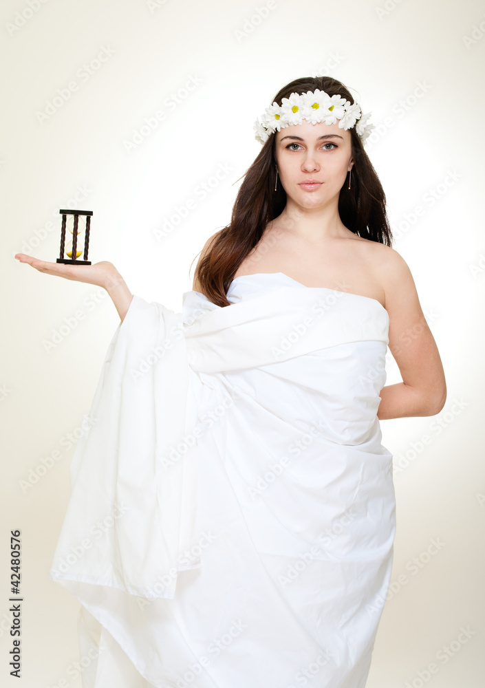 Time antique concept with young woman in chamomile