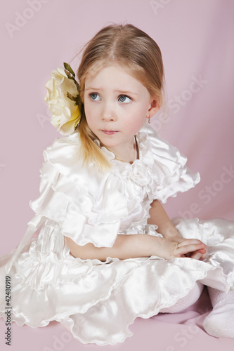 little girl in a white elegant dress