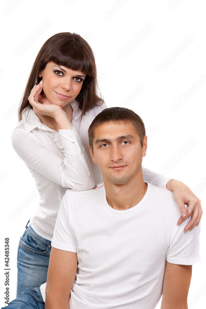 Portrait of a loving couple in the studio on a white Portrait of a loving couple in the studio on a white
