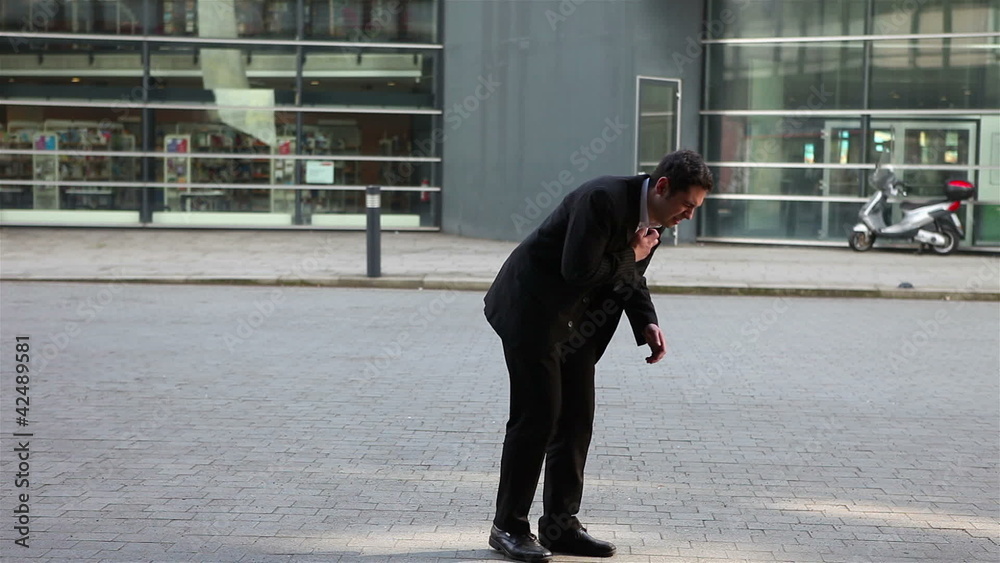 Business man having heart attack