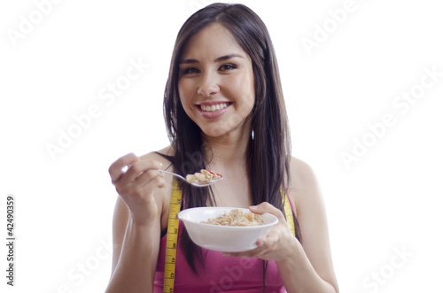 Young beautiful woman having a healthy breakfast