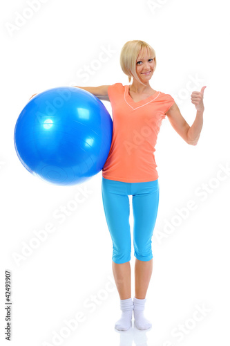 Young woman with blue ball