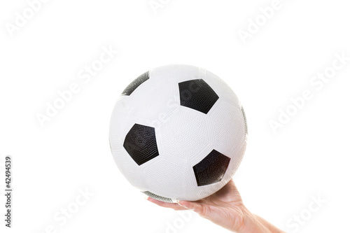 womans hand holding soccer ball