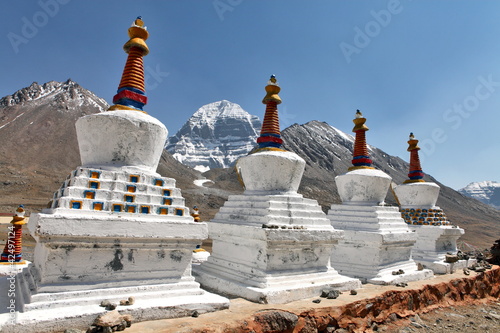 Buddhist statues in Tibet with holy Mount Kailash background